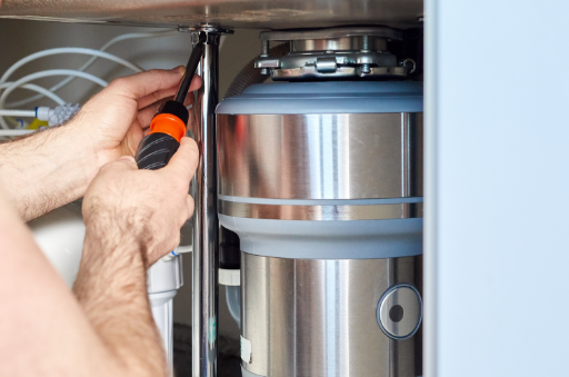 Garbage disposal being repaired